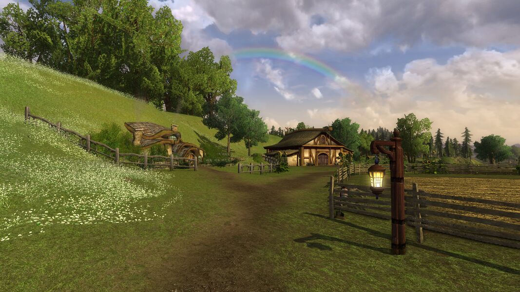 A dirt path through Hobbiton–Bywater farmland in LOTRO, passing a lit lantern, wooden fences and buildings beneath a rainbow.